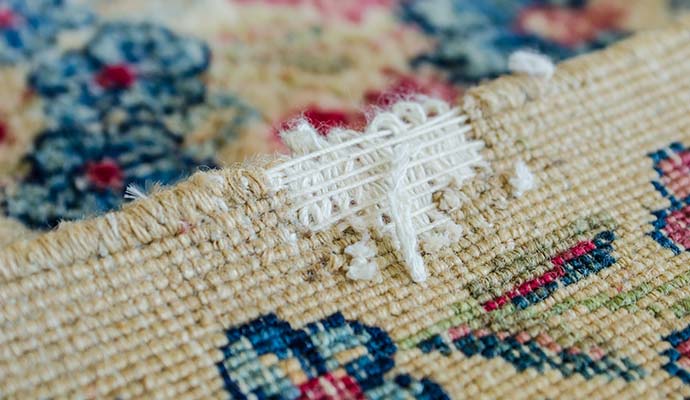 Close-up view of a damaged rug