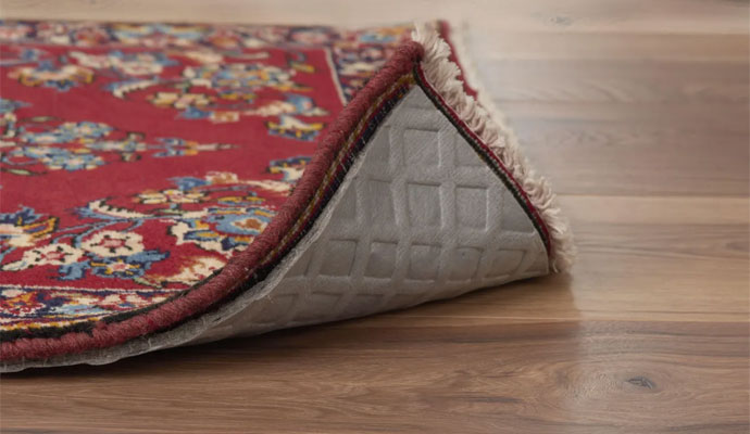 Pet barrier rug pad
