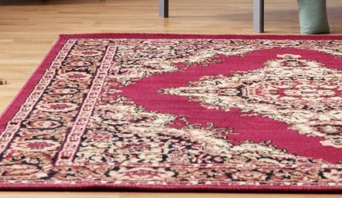 Freshly cleaned rug on wooden flooring Freshly cleaned rug on wooden flooring