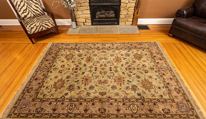 A cleaned rug is place on a room floor