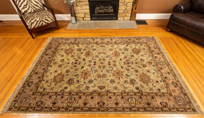 a colorful rug on the wooden floor