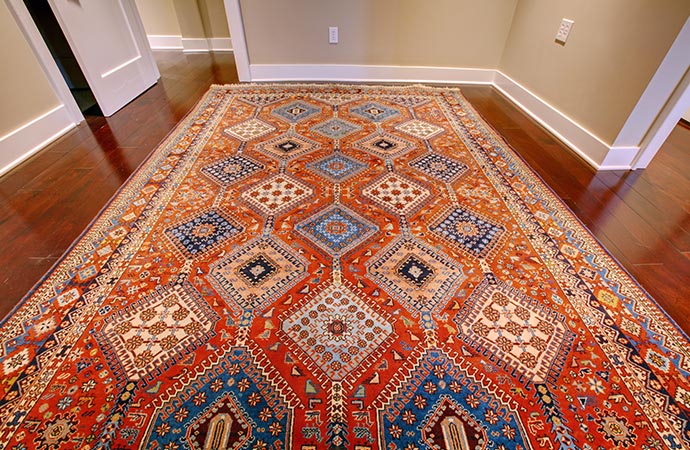Colorful pattern rug adds style to room. 